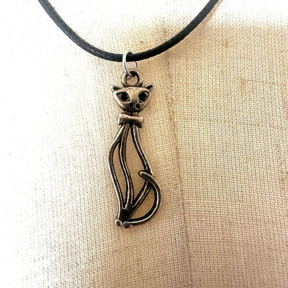 Silver tone cat pendant necklace on black cord
